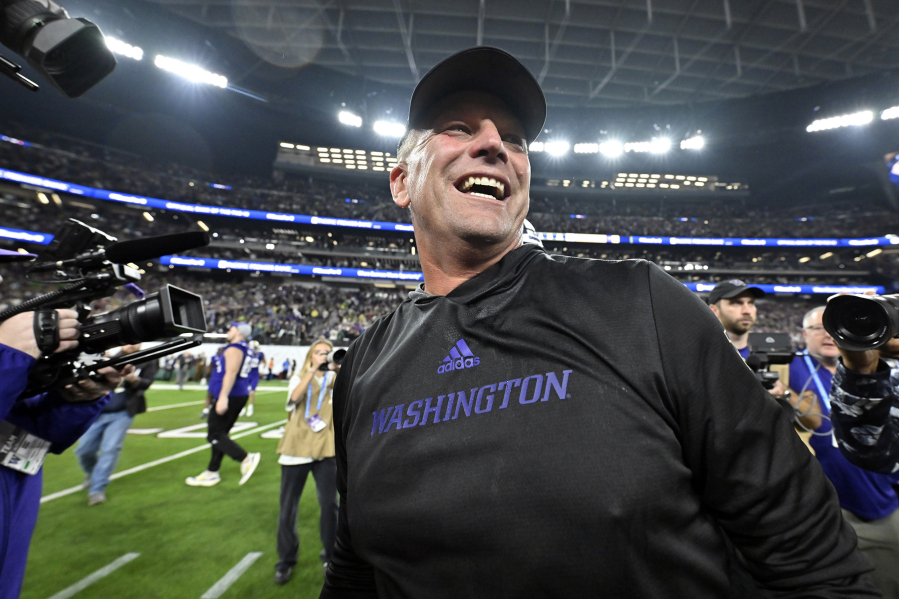 FILE - Washington coach Kalen DeBoer smiles after the team&rsquo;s victory over Oregon in the Pac-12 championship NCAA college football game, Dec. 1, 2023, in Las Vegas. DeBoer has made a rapid rise through the coaching ranks. He won three NAIA national championships as head coach at the University of Sioux Falls from 2005-09 and had five coaching stops in 12 years before landing at Washington.