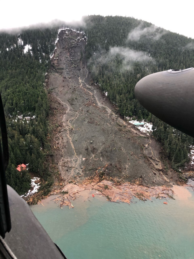 An Alaska Army National Guard UH-60 Black Hawk helicopter conducts search and rescue in Haines after a major landslide Dec. 3, 2020.