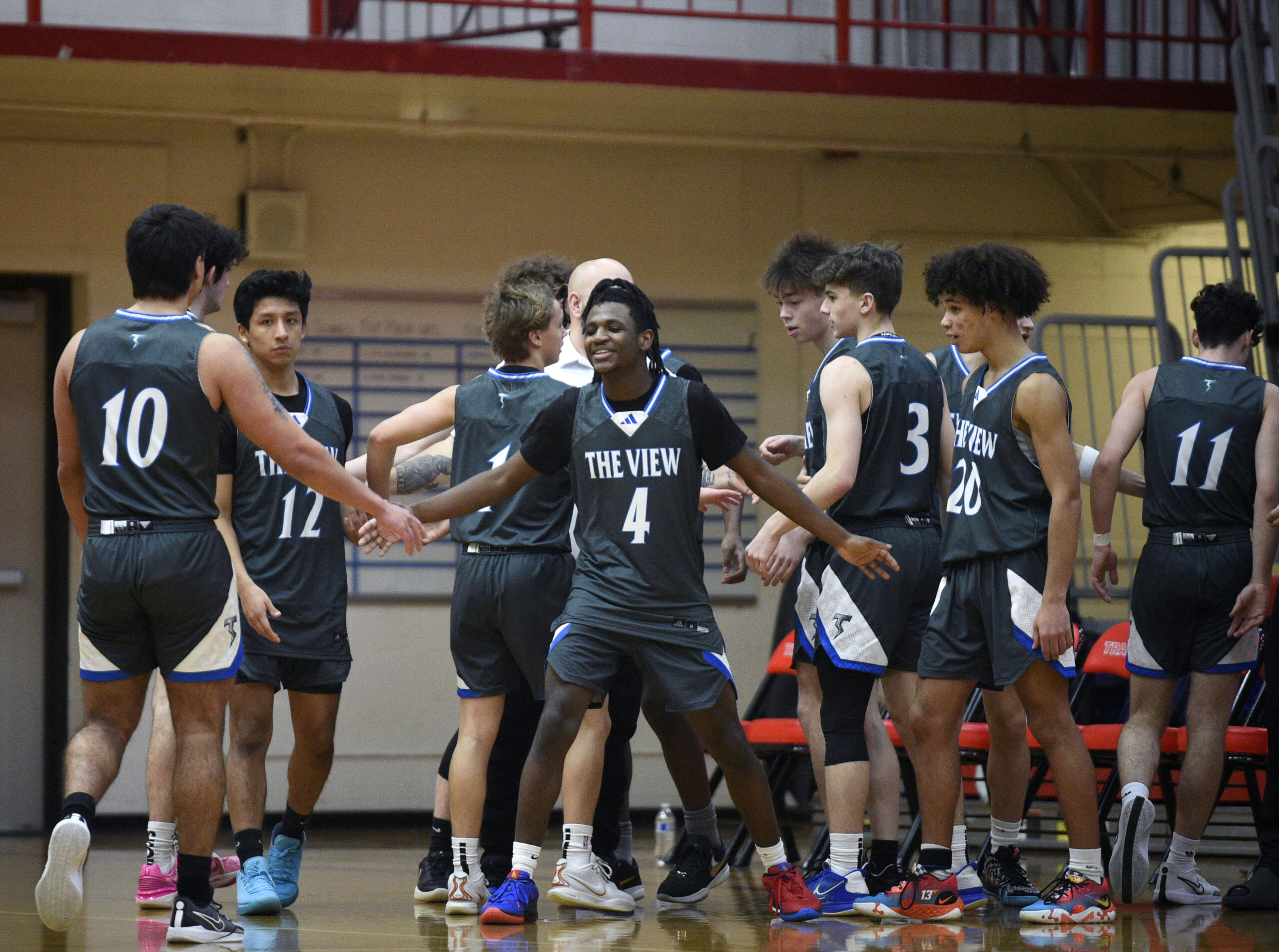 Mountain View’s Tommy Willson (4) greets Thunder teammates as they walk to the bench during a boys basketball game against Weed (Calif.) in the Myron Lawrence Memorial Tournament on Wednesday, Dec. 27, 2023, at Fort Vancouver High School.