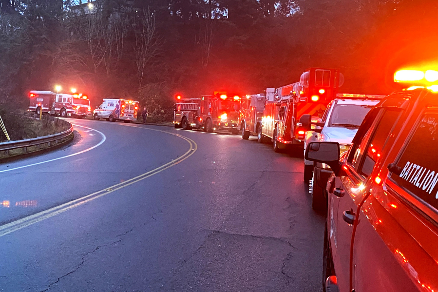 First responders line Hazel Dell Avenue on Thursday morning while rescue crews work to help an injured woman who&rsquo;d fallen down an embankment. The woman was taken to an area hospital with not life-threatening injuries.