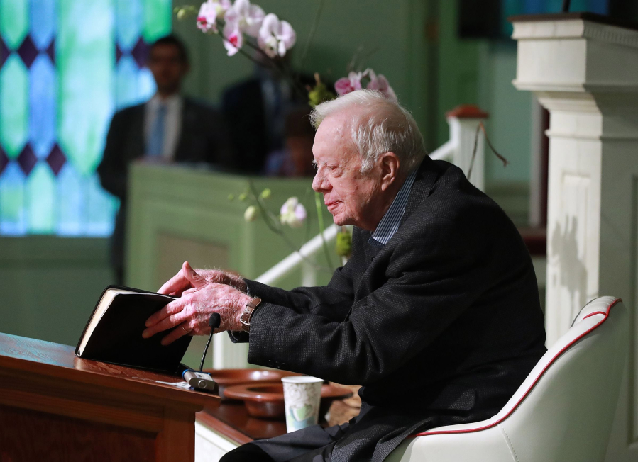 President Jimmy Carter, 94, the 39th U.S. president and Plains native, opens his Bible to begin the lesson June 9, 2019, as he returns to Maranatha Baptist Church to teach Sunday school less than a month after falling and breaking his hip in Plains, Ga.