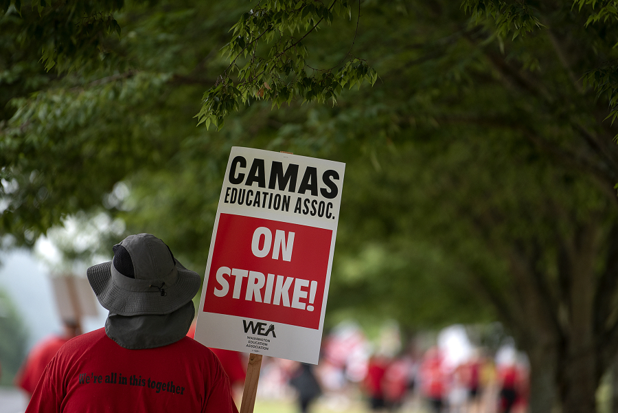 Camas teachers and supporters join a districtwide strike outside Camas High School on Aug. 28. The strike postponed the first six days of school.