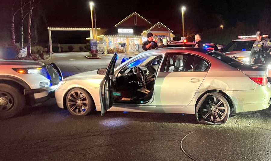 Washington County, Ore., sheriff&rsquo;s deputies pinned a BMW between patrol vehicles after the driver, a 30-year-old Vancouver man, allegedly sped away from police in Astoria, Ore., leading Oregon law enforcement on a chase Friday morning.
