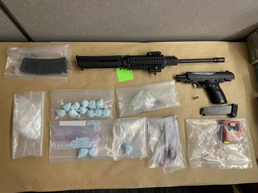 Suspected fentanyl pills and illegally owned guns investigators seized from a motel room in connection with a drug investigation Thursday during an area-wide stolen vehicle sting. The suspected owner, a 35-year-old Vancouver man, was one of several people arrested during the operation.