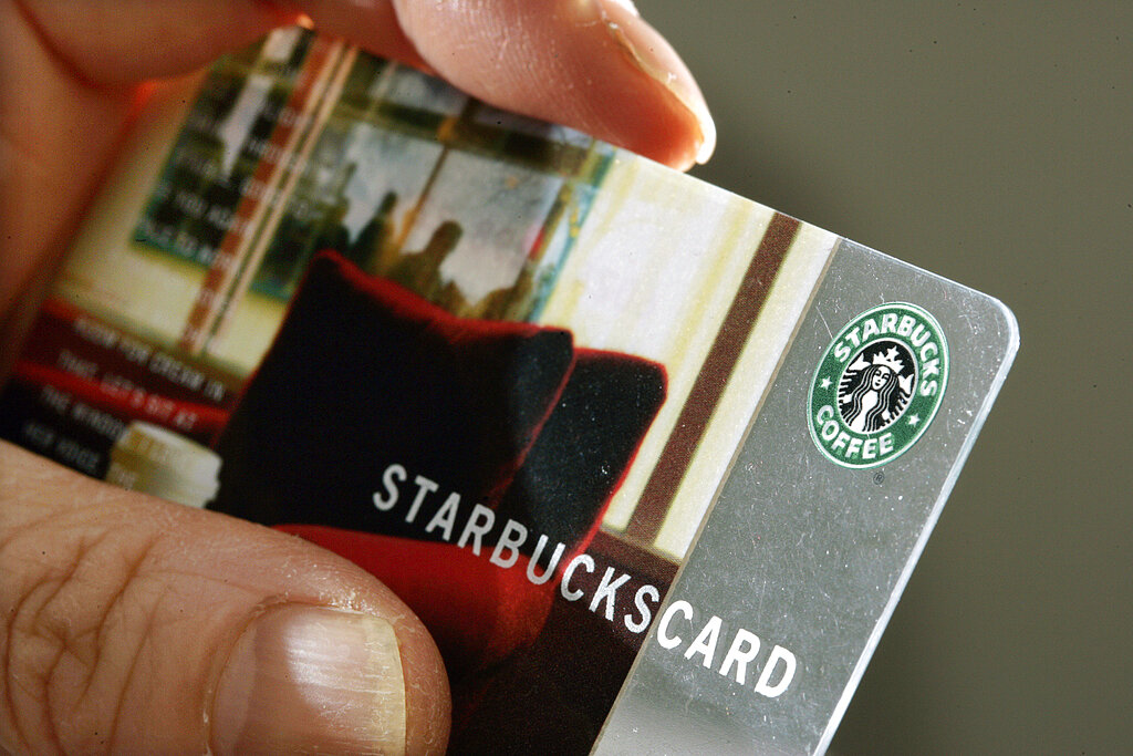 A person holds a Starbucks Coffee card in 2007.