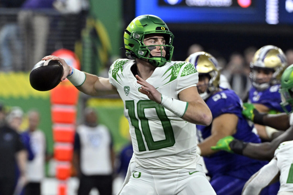 Oregon quarterback Bo Nix looks to pass against Washington during the first half of the Pac-12 championship NCAA college football game Friday, Dec. 1, 2023, in Las Vegas.
