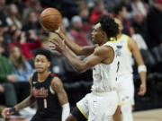 Utah Jazz guard Collin Sexton shoots against the Portland Trail Blazers during the second half of an NBA basketball game in Portland, Ore., Thursday, Dec. 14, 2023.