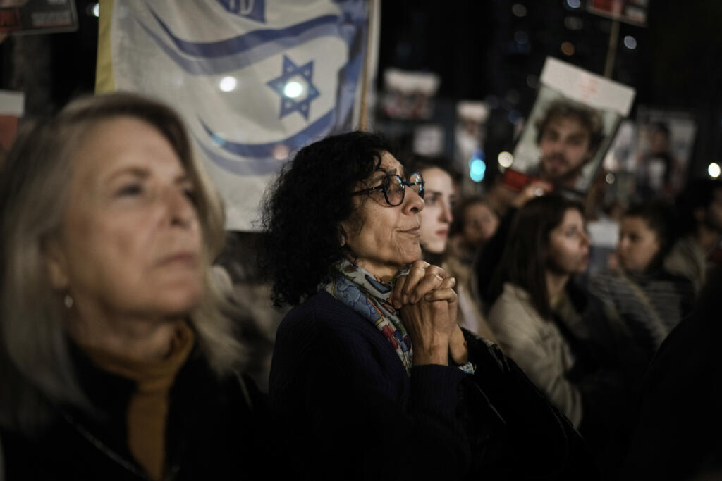 Families and supporters of Israeli hostages held by Hamas in Gaza attend a rally calling for their return, in Tel Aviv, Israel, Saturday, Dec. 16, 2023. More than 100 Israeli hostages are held in Gaza after being abducted in a Hamas cross-border attack on Oct. 7.