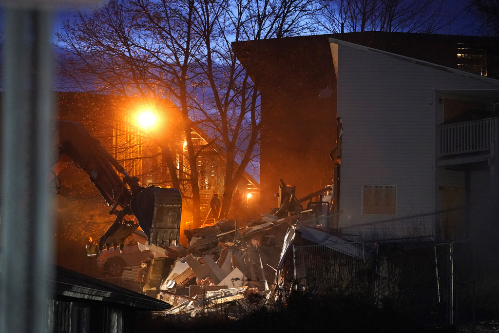 Heavy equipment is used to demolish the house where four University of Idaho students were killed in 2022 on Thursday, Dec. 28, 2023, in Moscow, Idaho. Students Ethan Chapin, Xana Kernodle, Madison Mogen and Kaylee Goncalves were fatally stabbed there in November 2022.  (AP Photo/Ted S.