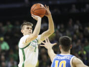 Oregon guard Brennan Rigsby (4) shoots over UCLA guard Lazar Stefanovic (10) during the first half of an NCAA college basketball game in Eugene, Ore., Saturday, Dec. 30, 2023.