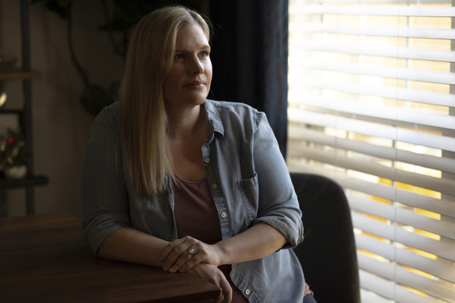 Kaitlyn Kash sits at her home, Sunday, Dec. 17, 2023, in Austin, Texas. Kash has joined as a plaintiff on the Zurawski v. State of Texas case, a lawsuit that looks to clarify the scope of the state&rsquo;s abortion ban.