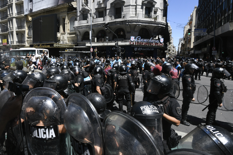 Police deploy after anti-government protesters rallied at the Supreme Court against the economic reforms of Argentine President Javier Milei, in downtown Buenos Aires, Argentina, Wednesday, Dec. 27, 2023.