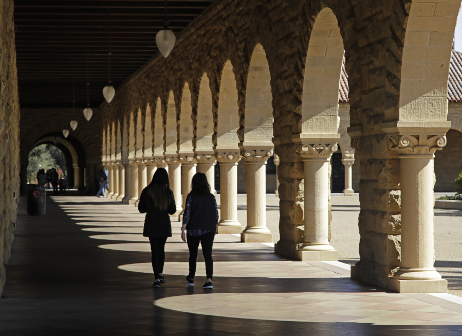 FILE - Students walk on the Stanford University campus on March 14, 2019, in Stanford, Calif. Hidden inside the foundation of popular artificial intelligence image-generators are thousands of images of child sexual abuse, according to a new report from the Stanford Internet Observatory that urges technology companies to take action to address a harmful flaw in the technology they built.