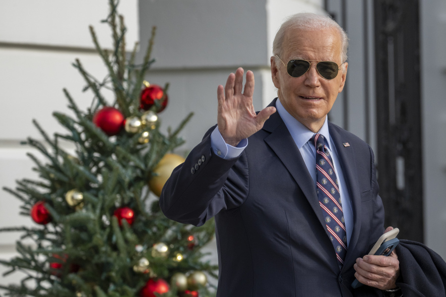 President Joe Biden waves as he walks to Marine One to depart the South Lawn of the White House, Tuesday, Dec. 5, 2023, in Washington. Biden is headed to Boston.