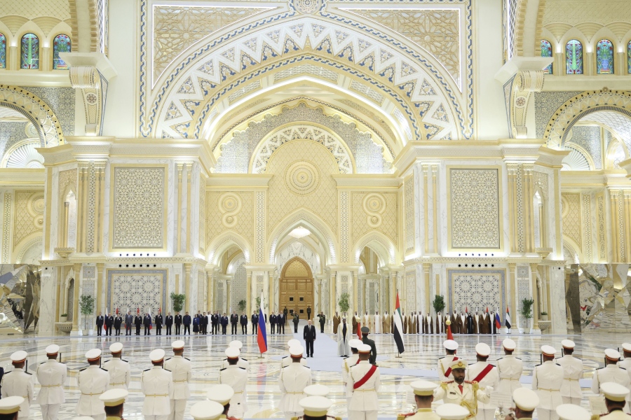 Emirati President Sheikh Mohammed bin Zayed Al Nahyan, center right, and Russian President Vladimir Putin, center left, attend an official welcome ceremony at Qasr Al Watan, Abu Dhabi, United Arab Emirates, Wednesday, Dec. 6, 2023.
