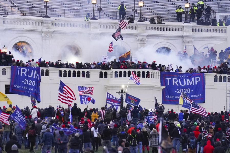 FILE - Rioters at the U.S. Capitol on Jan. 6, 2021, in Washington.  Frank Rocco Giustino, who skipped court hearings, profanely insulted a prosecutor and berated a federal judge, has been sentenced to three months behind bars for joining the mob that attacked the U.S. Capitol on Jan. 6, 2021.