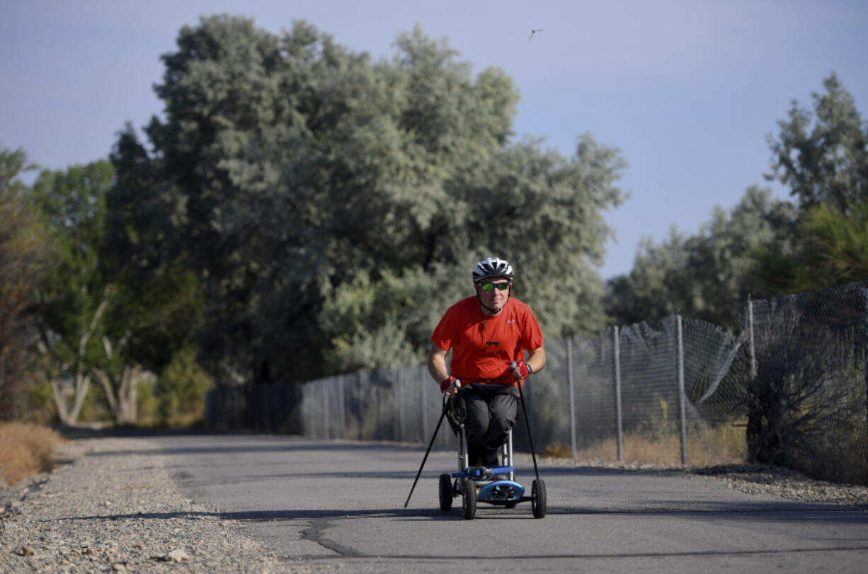 FILE - Kevin Hoyt rolls along as he exercises using a paraplegic-friendly mountainboard that was adapted for his use, July 8, 2017 along the Jordan River Parkway trail in Saratoga Springs, Utah. The U.S. Census Bureau wants to change how it asks people about disabilities, and some advocates are complaining that they were not consulted enough on what amounts to a major overhaul in how disabilities would be defined by the federal government.