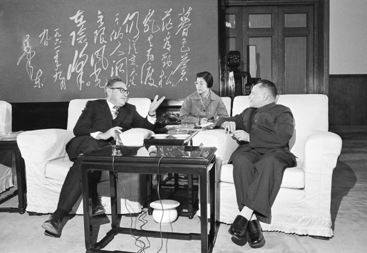 FILE - Then Chinese Premier Deng Xiaoping, right, listens as then U.S. Secretary of State Henry Kissinger speaks during their meeting in Beijing, Nov. 27, 1974. Official China called Kissinger &ldquo;an old friend.&rdquo; A commentator likened him to a giant panda, a goodwill ambassador between two countries that have been more often at odds over the decades than not. Kissinger, who died Wednesday, Nov. 29, 2023, developed a special relationship with China in the second half of his 100-year-long life.