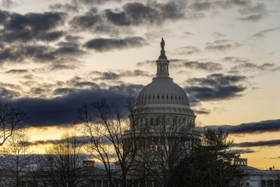 The Capitol is seen under a winter sky in Washington, Monday, Dec. 18, 2023, as White House and Senate negotiators are struggling to reach a U.S. border security deal that would unlock President Joe Biden&#039;s request for billions of dollars worth in military aid for Ukraine and national security. (AP Photo/J.