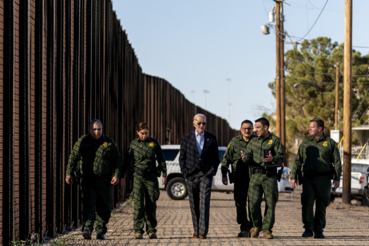 FILE - President Joe Biden talks with U.S. Border Patrol agents as they walk along a stretch of the U.S.-Mexico border in El Paso Texas, Sunday, Jan. 8, 2023. A deal to provide further U.S. assistance to Ukraine by year-end appears to be increasingly out of reach for President Joe Biden. Republicans are insisting on pairing the funding with changes to America&rsquo;s immigration and border policies.