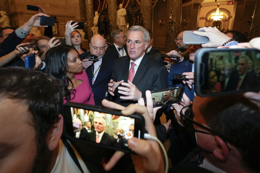 FILE - Reporters surround Rep. Kevin McCarthy, R-Calif., as he walks out of the House chambers after the House met for the third day to elect a speaker and convene the 118th Congress in Washington, Thursday, Jan. 5, 2023.