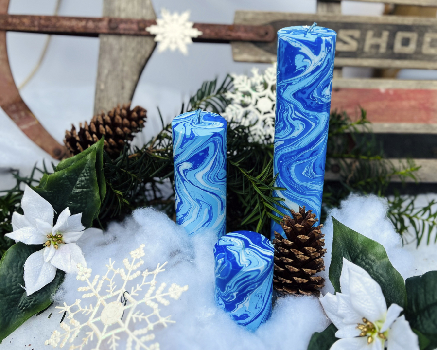 Three blue hand-dyed marbleized candles by Paula Lavender Tucker.