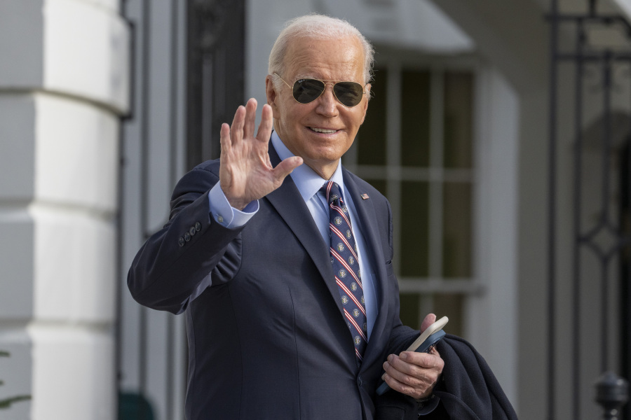 FILE - President Joe Biden waves as he walks to Marine One to depart the South Lawn of the White House, Dec. 5, 2023, in Washington. Biden and first lady Jill Biden plan to attend six fundraising events between them this weekend in Los Angeles, asking some of the glitziest names in town to open their checkbooks for his reelection campaign.