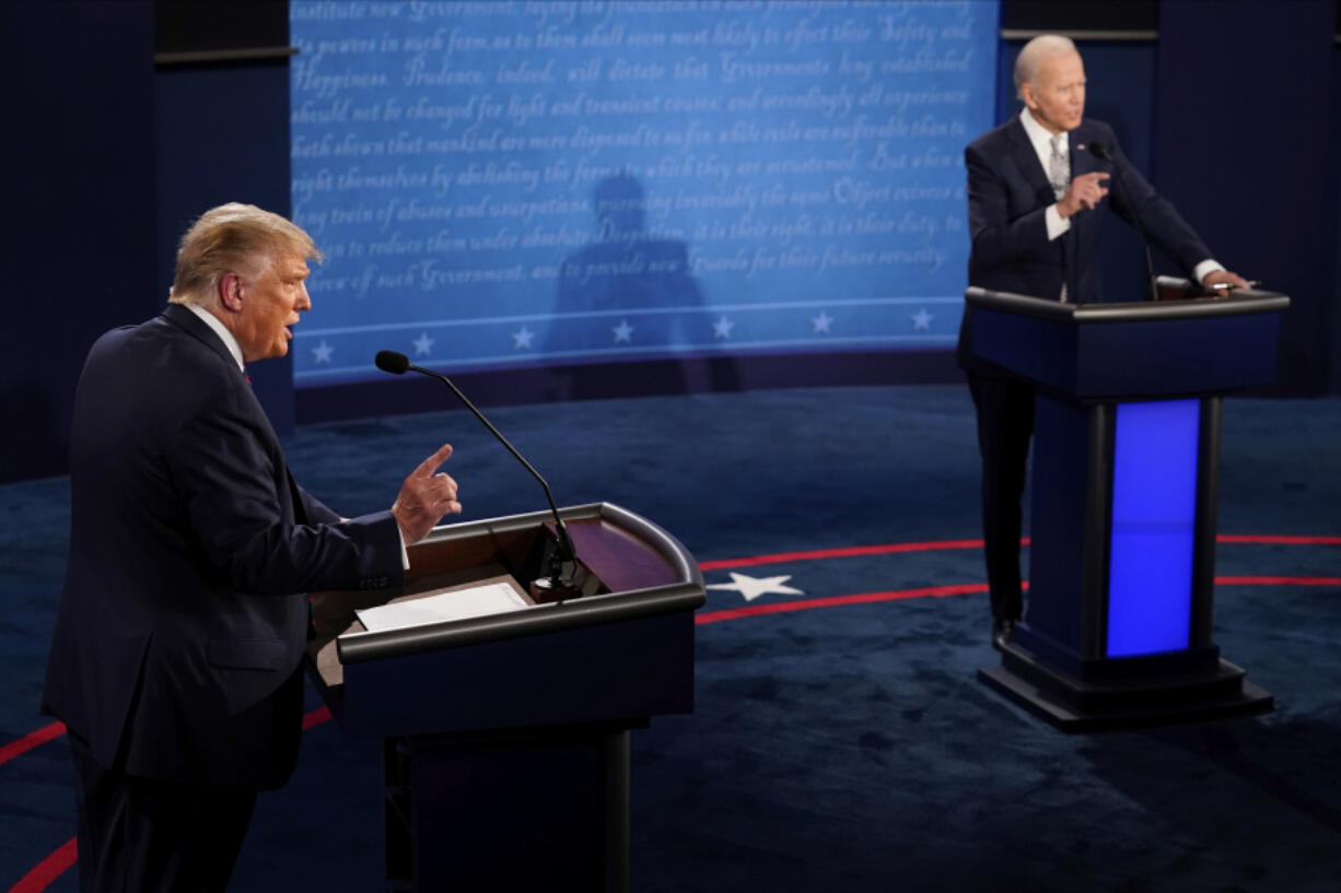 FILE - President Donald Trump and Democratic presidential candidate former Vice President Joe Biden exchange points during the first presidential debate Sept. 29, 2020, at Case Western University and Cleveland Clinic, in Cleveland, Ohio. President Joe Biden is trying to focus the campaign on former President Donald Trump&#039;s comments and policy proposals, sometimes more than his own. It&#039;s a time-worn strategy of White House incumbents to try to negatively define their rivals in the public&#039;s eyes.
