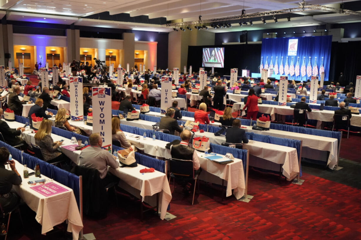 FILE - Delegates are seated for the first day of the Republican National Convention, Aug. 24, 2020, in Charlotte, N.C. Winning the presidential nomination is all about delegates. But how does the process work?