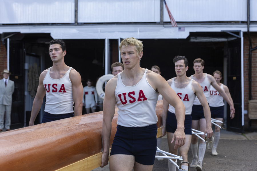This image released by MGM Pictures shows Callum Turner, center, in a scene from &ldquo;The Boys in the Boat.&rdquo; (Laurie Sparham/Metro-Goldwyn-Mayer Pictures via AP)