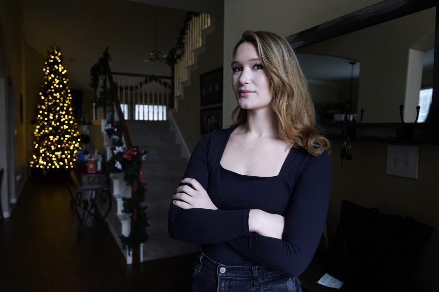 Nicole Plauch&eacute;, 23, poses for a photo at her family&rsquo;s home in Highland Village, Texas, Friday, Dec. 15, 2023. Plauch&eacute; graduated from college last year with a business degree and  is navigating how to manage holiday spending while paying student loan debt.
