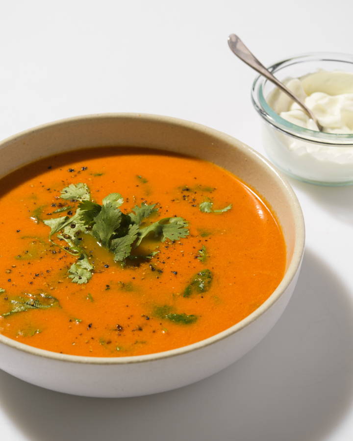 This image released by Milk Street shows a recipe for Indian-style tomato-ginger soup.