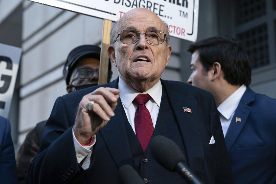 FILE - Former Mayor of New York Rudy Giuliani speaks during a news conference outside the federal courthouse in Washington, Friday, Dec. 15, 2023. A jury awarded $148 million in damages on Friday to two former Georgia election workers who sued Giuliani for defamation over lies he spread about them in 2020 that upended their lives with racist threats and harassment.