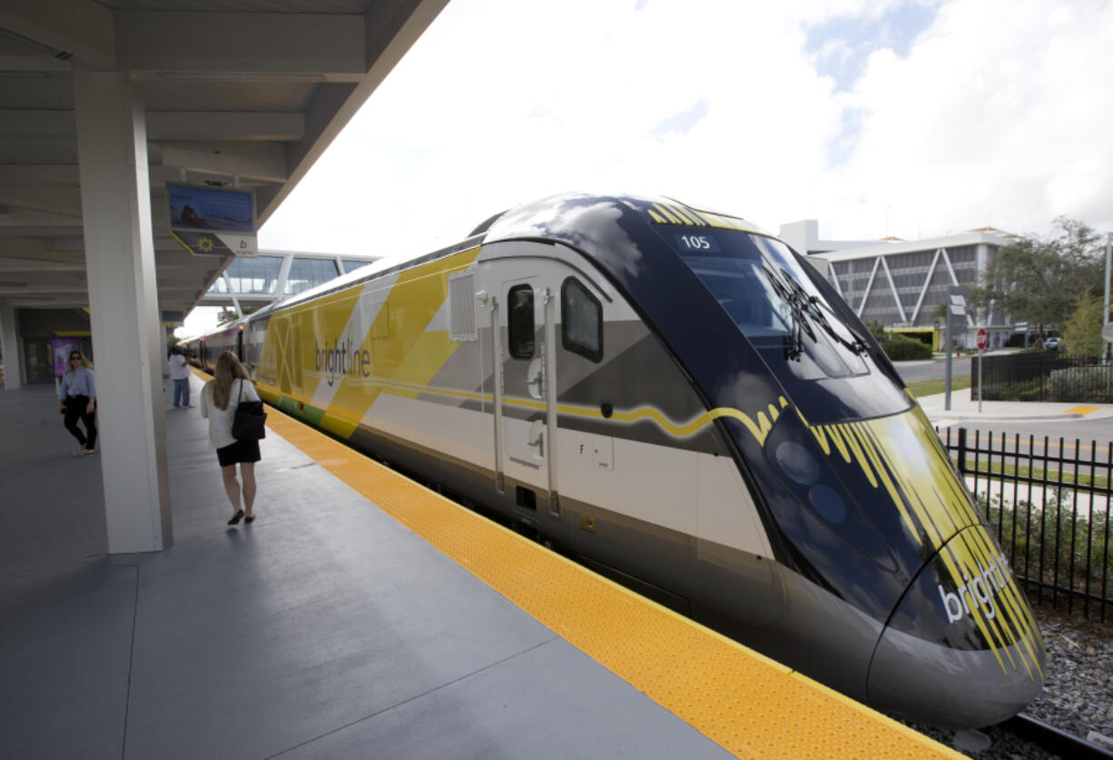 FILE - A Brightline train is shown at a station in Fort Lauderdale, Fla., on Jan. 11, 2018. A high-speed rail line between Las Vegas and the Los Angeles area is getting a Biden administration pledge of $3 billion to help start laying track. Nevada&rsquo;s two Democratic U.S. senators said Tuesday, Dec. 5, 2023 the $12 billion project led by Brightline West has all required right-of-way, environmental and labor approvals.