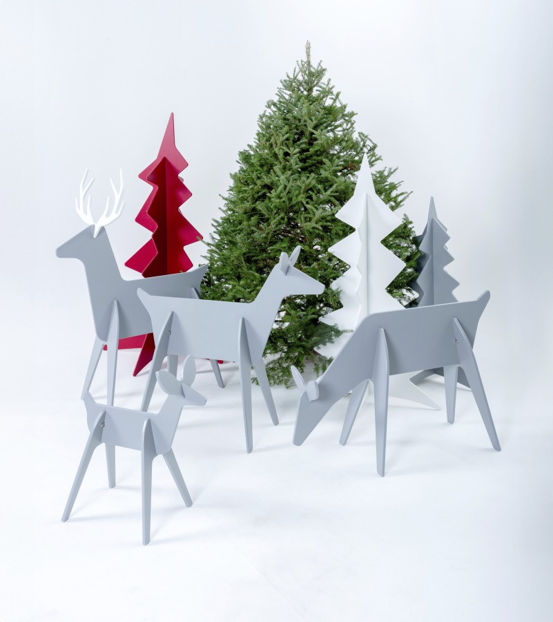 Minimalist contemporary wooden Christmas trees and reindeer fit together with simple slots, and are easy to stash under a bed or behind a cupboard.