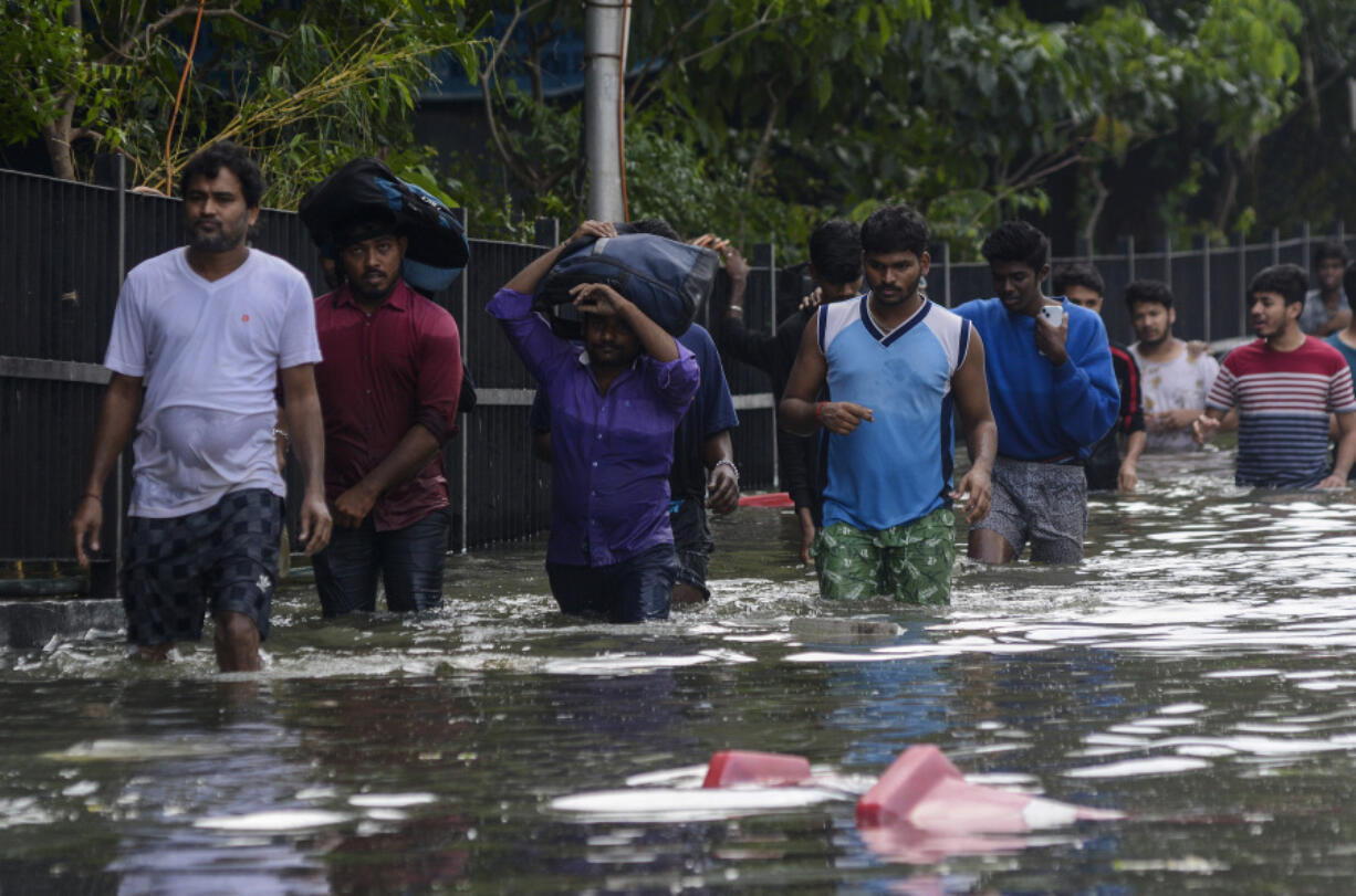 Heavy rains leave at least 12 dead before storm Michaung makes landfall on  India's southeast coast