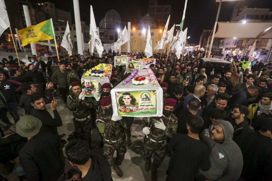 Iraqis attend the funeral of the Kataib Hezbollah members in Najaf, Iraq, Wednesday, Nov 22, 2023. Kataib Hezbollah fighters were killed in the US airstrikes in response to attacks against U.S. forces at Al-Asad Air Base earlier this week.