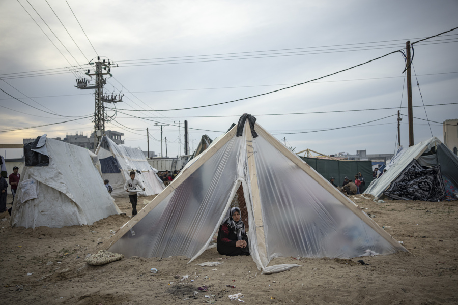 Palestinians displaced by the Israeli ground offensive on the Gaza Strip set up a tent camp in the Muwasi area Thursday, Dec. 7, 2023.
