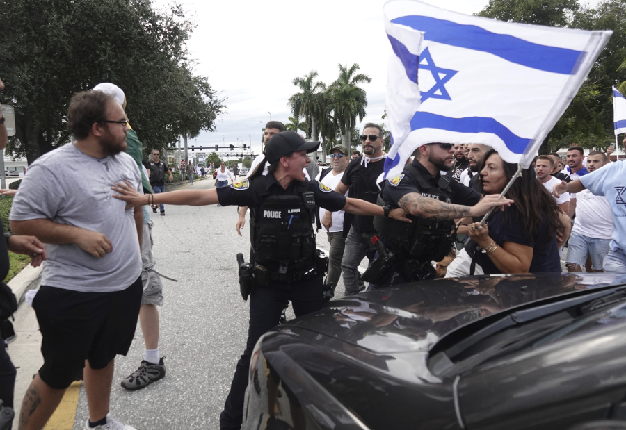 FILE - Fort Lauderdale police separate members of pro-Israel and pro-Palestinian protests, Sunday, Oct. 8, 2023, in Fort Lauderdale, Fla. State lawmakers across the country are expected consider legislation related to the Israel-Hamas war in 2024.