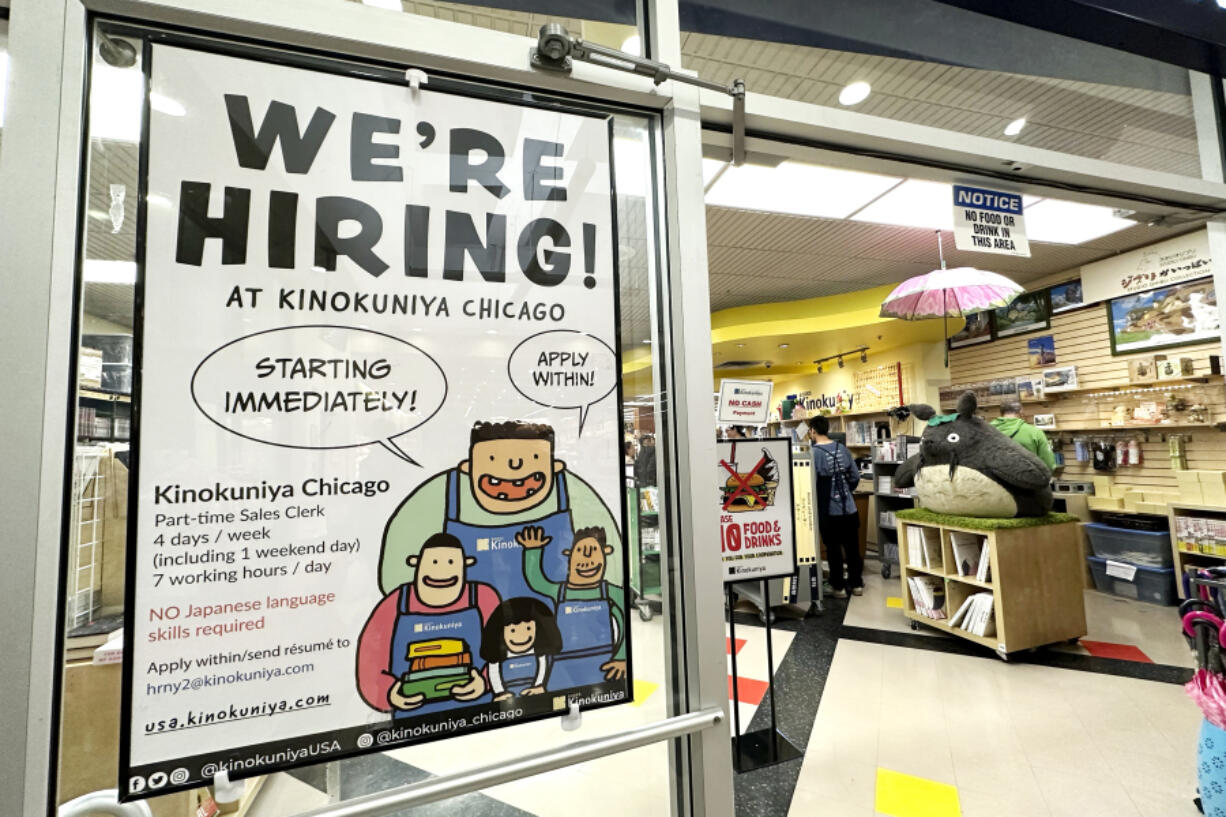 File - A hiring sign is displayed at a retail store in Arlington Heights, Ill., on Oct. 10, 2023. On Tuesday, the Labor Department reports on job openings and labor turnover for October. (AP Photo/Nam Y.