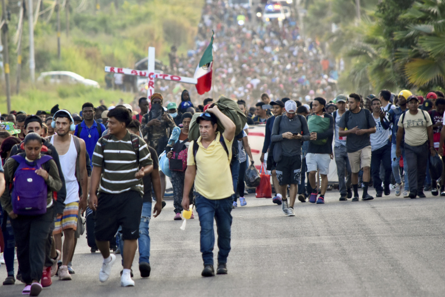 Migrants depart from Tapachula, Mexico, Sunday, Dec. 24, 2023. The caravan started the trek north through Mexico just days before U.S. Secretary of State Antony Blinken arrives in Mexico City to discuss new agreements to control the surge of migrants seeking entry into the United States. (AP Photo/Edgar H.