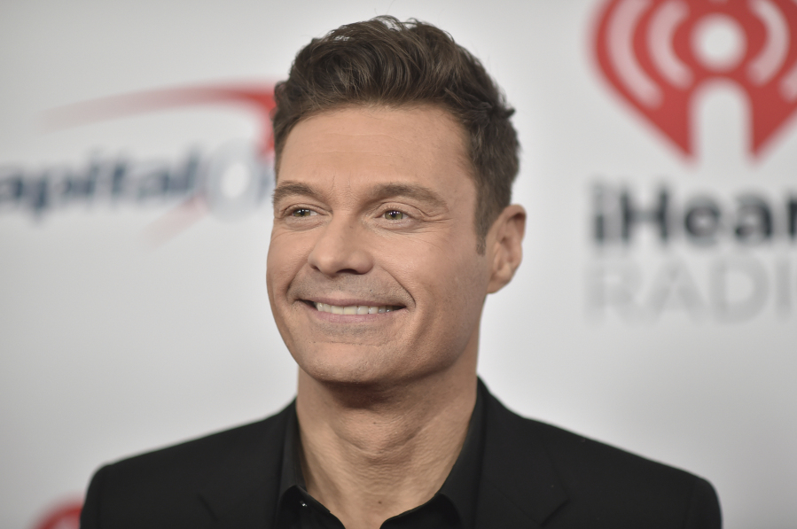 FILE - Ryan Seacrest arrives at the the 2021 Jingle Ball Los Angeles in Inglewood, Calif., on  Dec. 3, 2021. Seacrest will usher in 2024 on &ldquo;New Year&rsquo;s Rockin&rsquo; Eve&rdquo; from Times Square, with satellite locations in Los Angeles and San Juan, Puerto Rico.