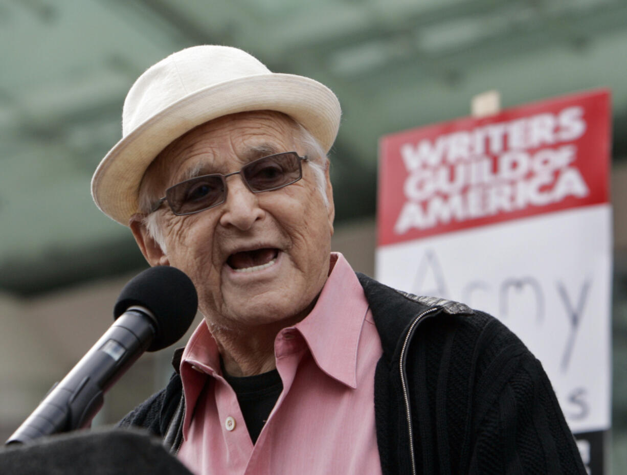 FILE - Producer Norman Lear speaks in support of thousands of Writers Guild of America (WGA) writers and others in the fifth day of their strike against the Alliance of Motion Picture and Television Producers (AMPTP) in a rally at Fox Plaza in Los Angeles&rsquo; Century City district on Nov. 9, 2007. Lear, producer of TV&rsquo;s &lsquo;All in the Family&rsquo; and influential liberal advocate, died Tuesday, Dec. 5, 2023, at 101.