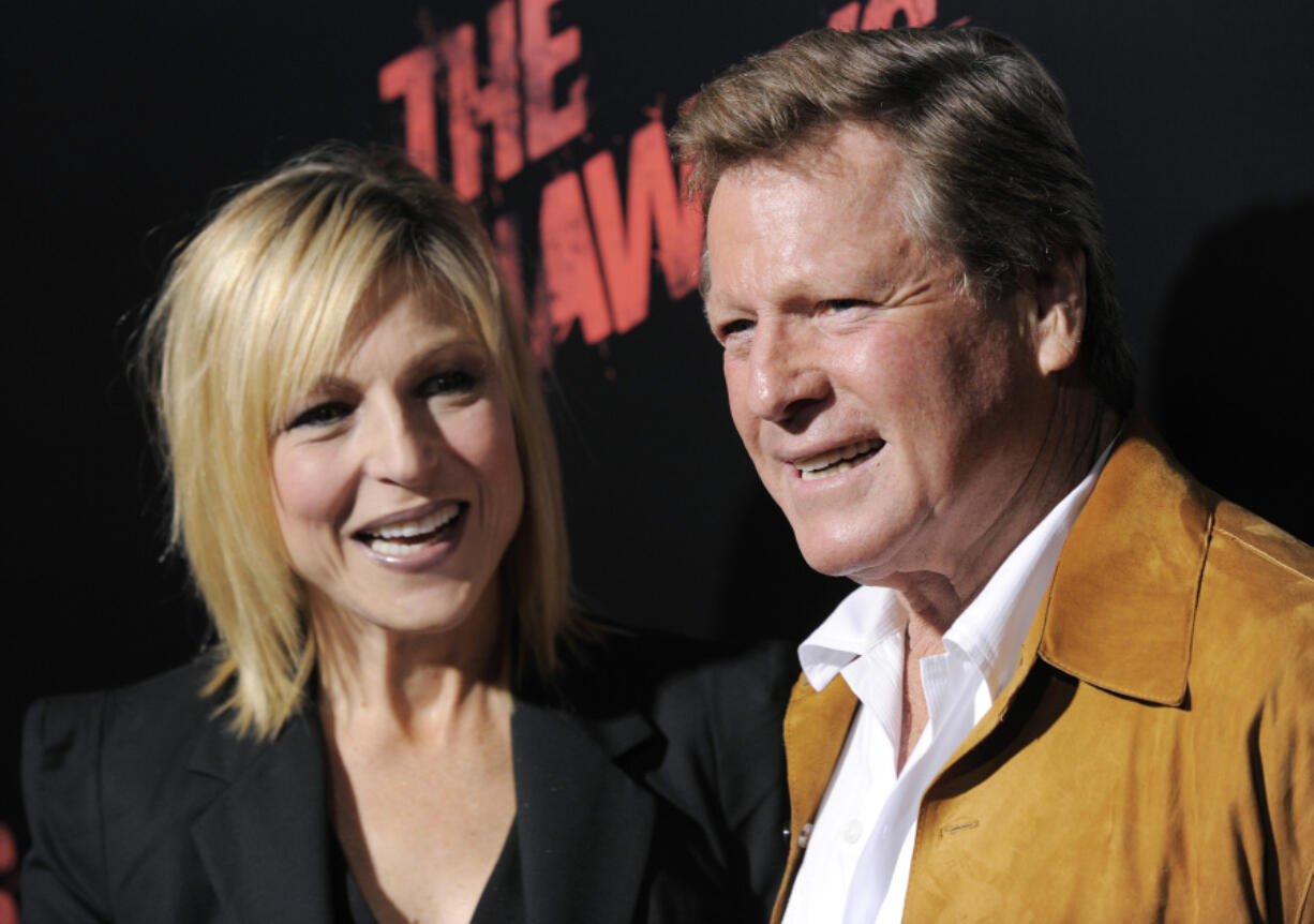 FILE - Tatum O&#039;Neal, left, a cast member in &quot;The Runaways,&quot; and her father, actor Ryan O&#039;Neal, pose together at the premiere of the film in Los Angeles, Thursday, March 11, 2010. Ryan O&rsquo;Neal, who was nominated for an Oscar for the tear-jerker &ldquo;Love Story&rdquo; and played opposite his precocious daughter Tatum in &ldquo;Paper Moon,&rdquo; has died. O&rsquo;Neal&#039;s son Patrick said on Instagram that his father died Friday, Dec. 8, 2023.