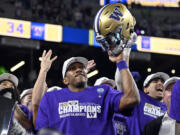 Washington quarterback Michael Penix Jr. celebrates after the team defeated Oregon in the Pac-12 championship NCAA college football game Friday, Dec. 1, 2023, in Las Vegas.