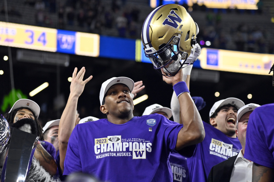 Washington quarterback Michael Penix Jr. celebrates after the team defeated Oregon in the Pac-12 championship NCAA college football game Friday, Dec. 1, 2023, in Las Vegas.