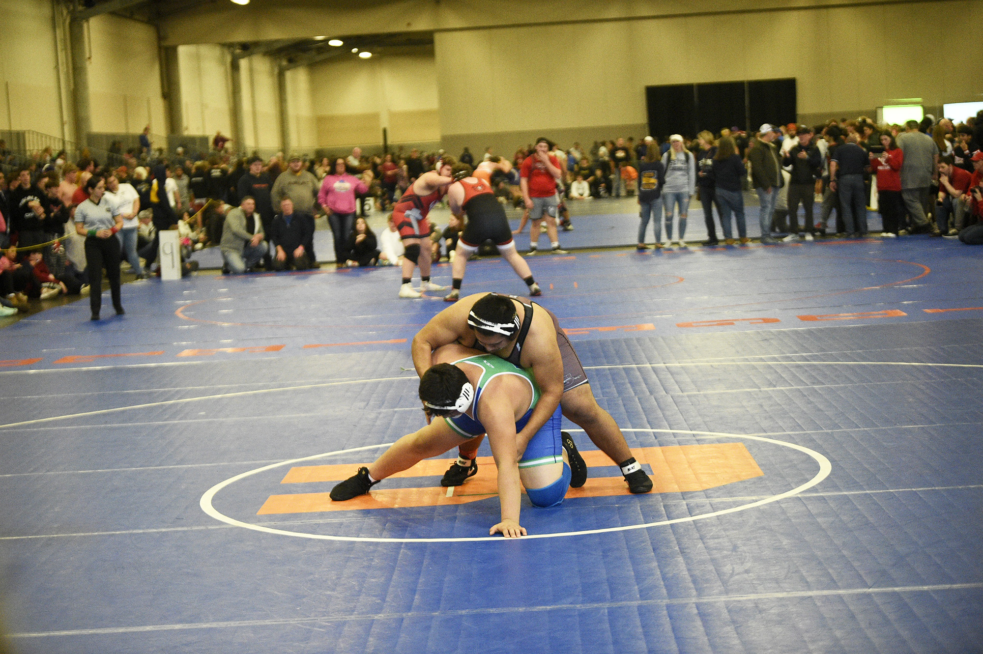 Enrique Valle of Grandview (top) wrestles Jimmy Martinez-Alvar of Mountain View in a first-round match in the 285-pound boys bracket of the Pacific Coast Championships wrestling tournament at the Clark County Events Center in Ridgefield on Thursday, Dec. 21, 2023.