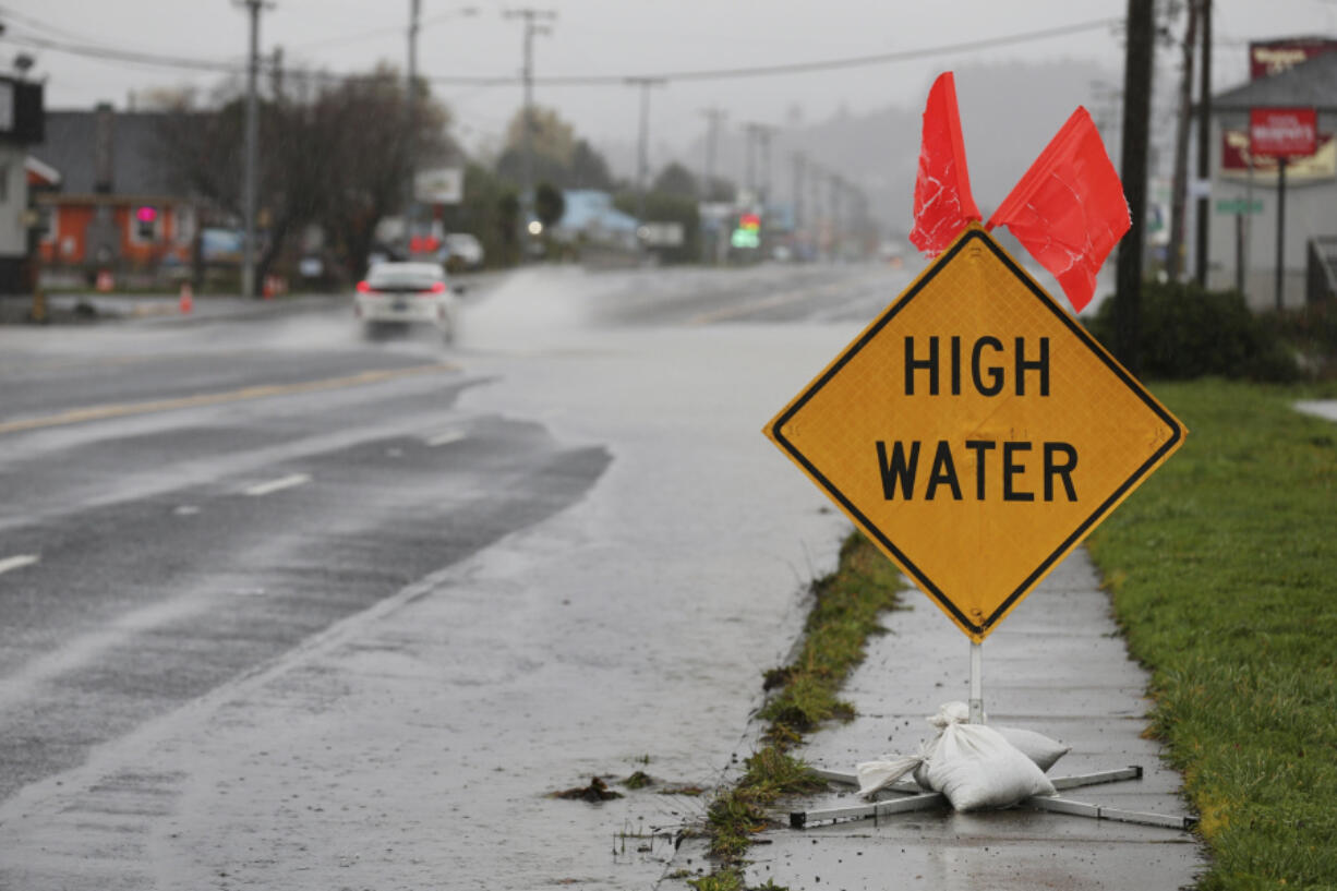 Heavy rain causes high water and flooding along Highway 101 in Tillamook, Ore., on Tuesday, Dec. 5, 2023.