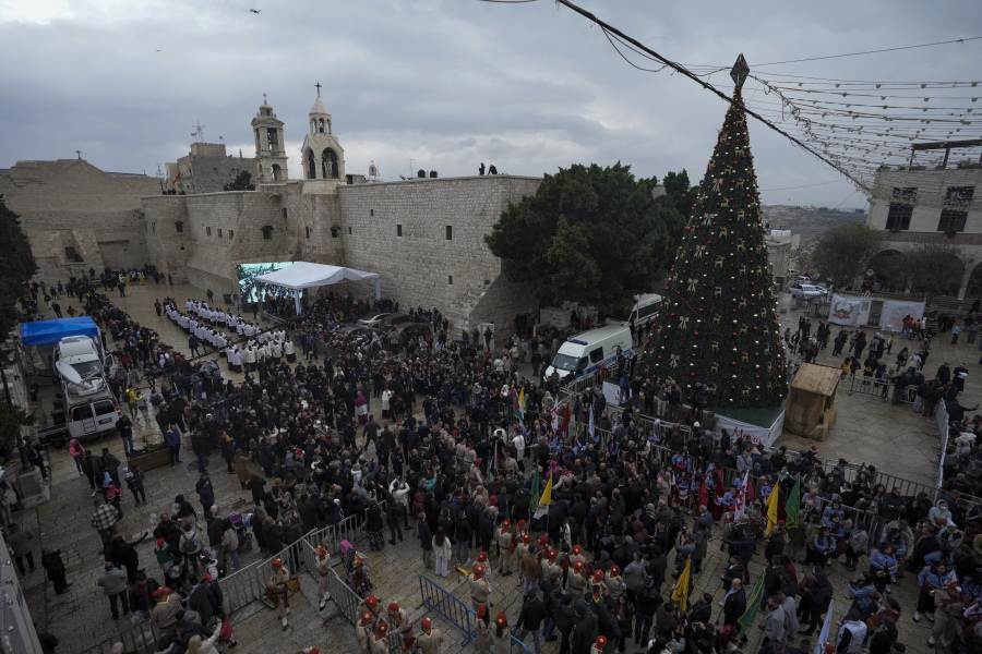 FILE - In this Saturday, Dec. 24, 2022, file photo, Latin Patriarch Pierbattista Pizzaballa greets worshippers in Manger Square, adjacent to the Church of the Nativity, traditionally believed to be the birthplace of Jesus Christ, in the West Bank town of Bethlehem during Christmas celebrations.
