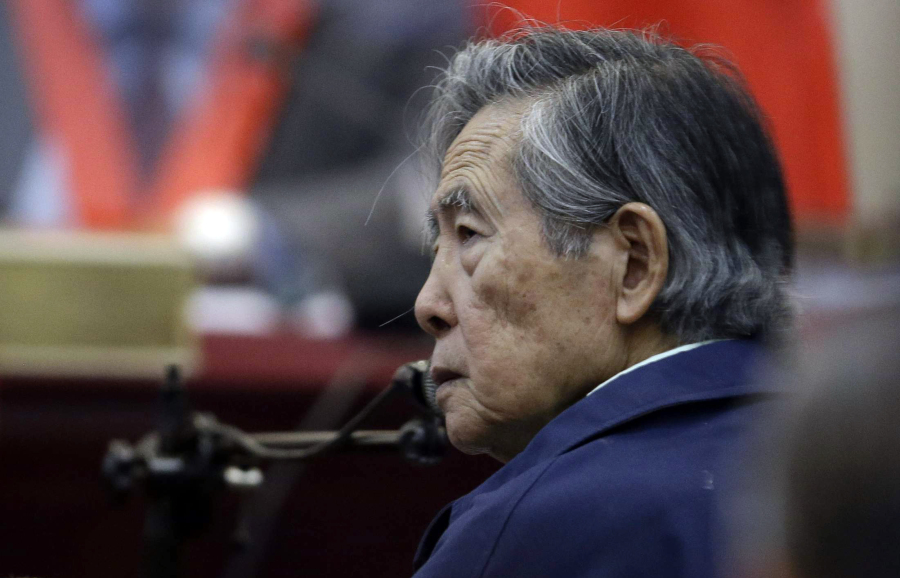 FILE - Peru&rsquo;s former President Alberto Fujimori listens to a question during his testimony in a courtroom at a military base in Callao, Peru, March 15, 2018. The South American country&acute;s Constitutional Court ordered on Tuesday, Nov. 28, 2023, that Fujimori, who is serving a 25-year prison sentence for human rights violations and corruption, be released from prison.